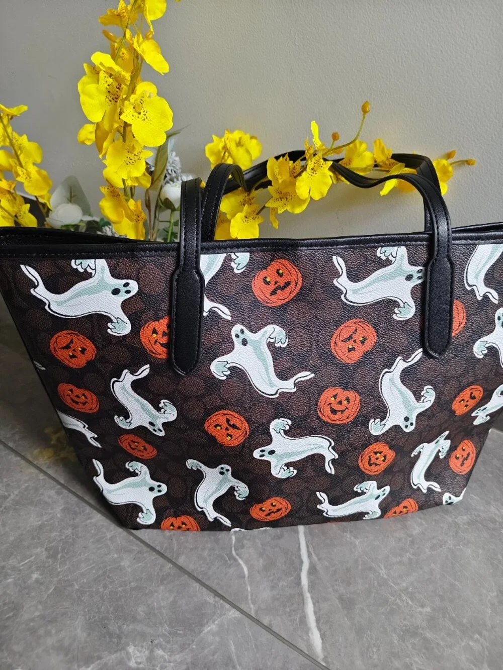 Coach tote featuring